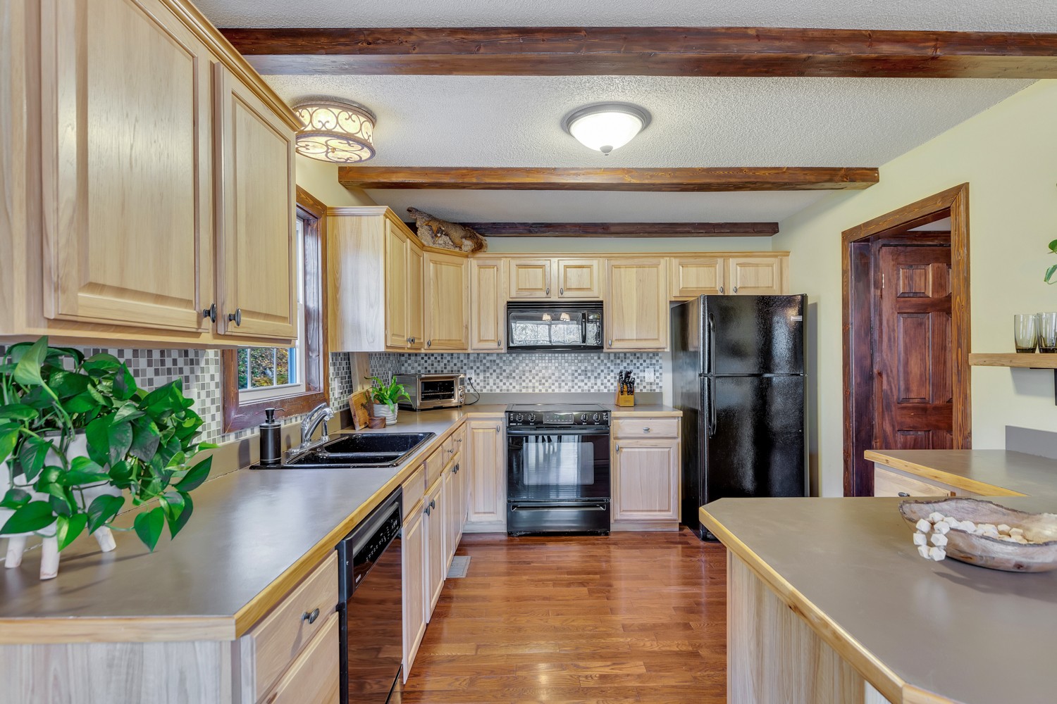 325 Silver Point Road Silver Point, TN 38582 - Photo 11 of 24 a kitchen with stainless steel appliances granite countertop a sink a stove and a refrigerator