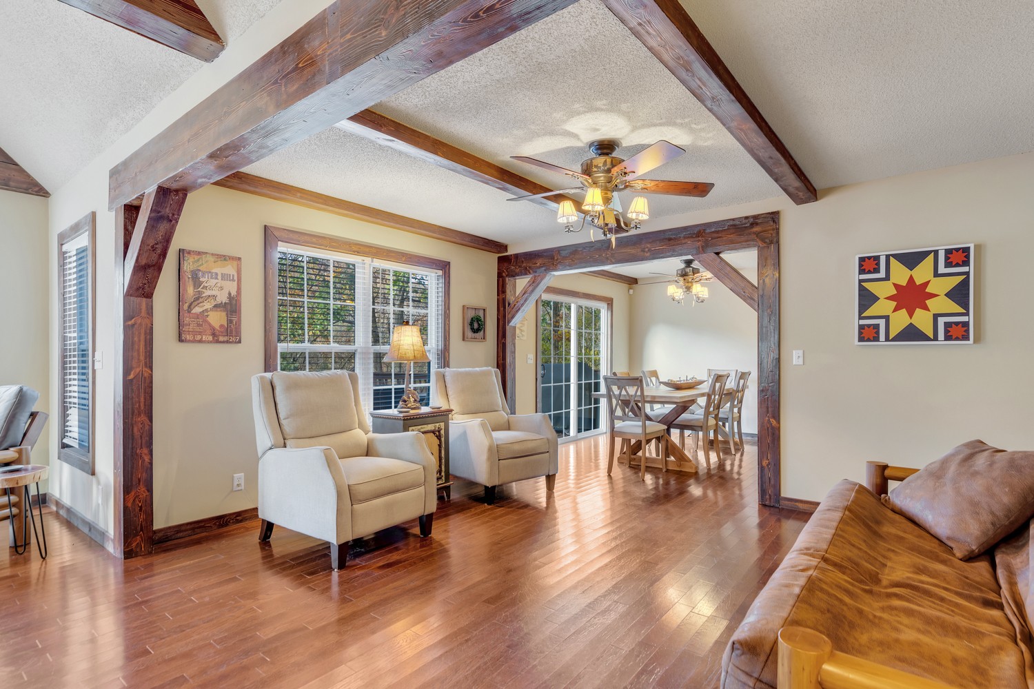 325 Silver Point Road Silver Point, TN 38582 - Photo 8 of 24 a living room with furniture a chandelier and a wooden floor