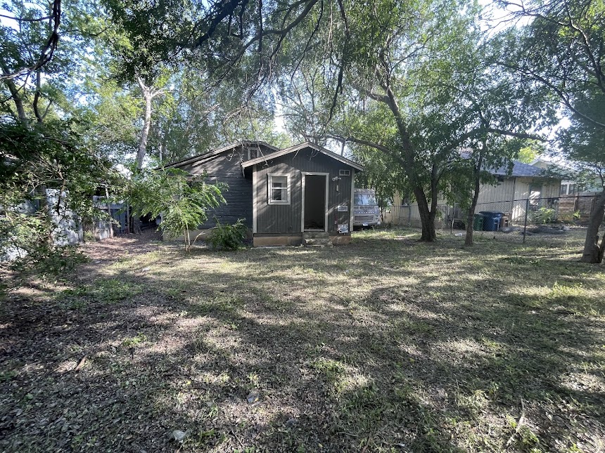 3208 East 16th Street Austin, TX 78721 - Photo 5 of 11 A private backyard oasis awaits, offering ample space for recreation or quiet contemplation.