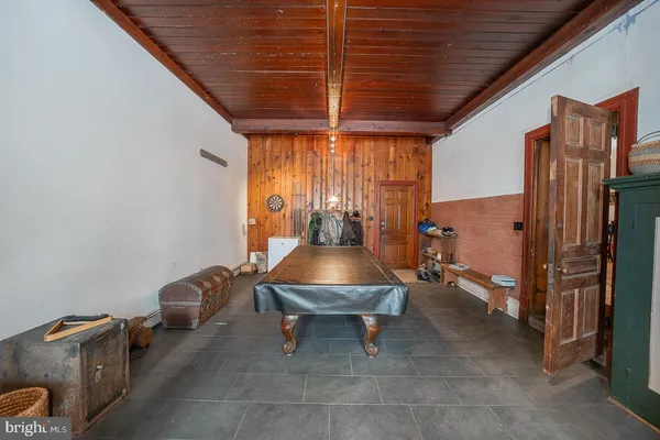 a view of living room with furniture and wooden floor