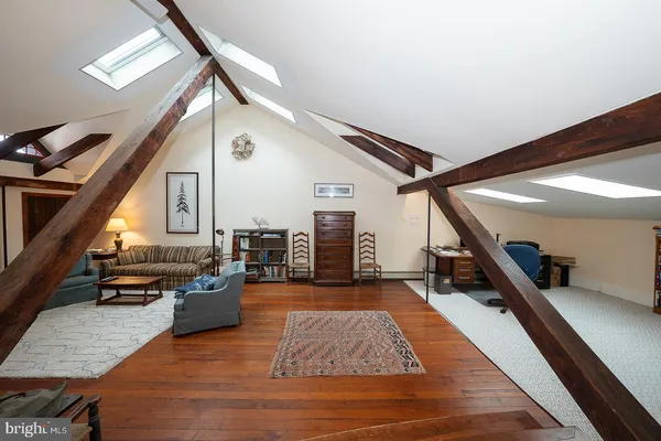 a view of a empty room with wooden ceiling