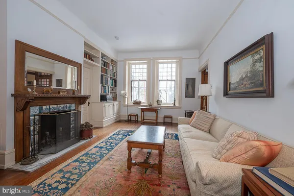 a living room with furniture a window and a fireplace