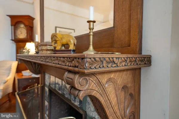a bedroom with a bed a books bucket with a desk and chair