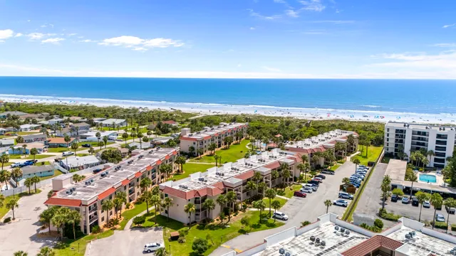 an aerial view of residential houses with outdoor space