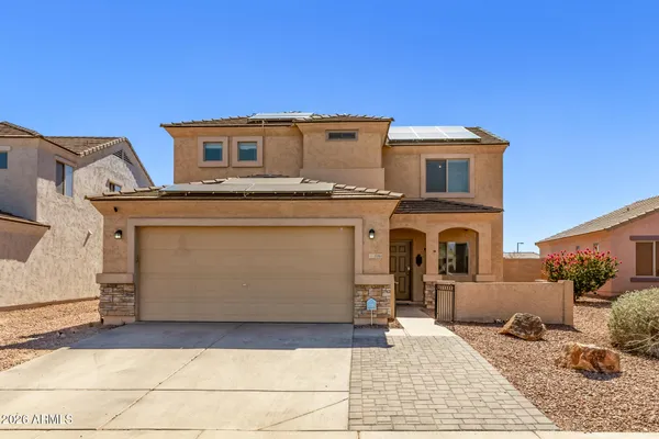 a front view of a house with a garage