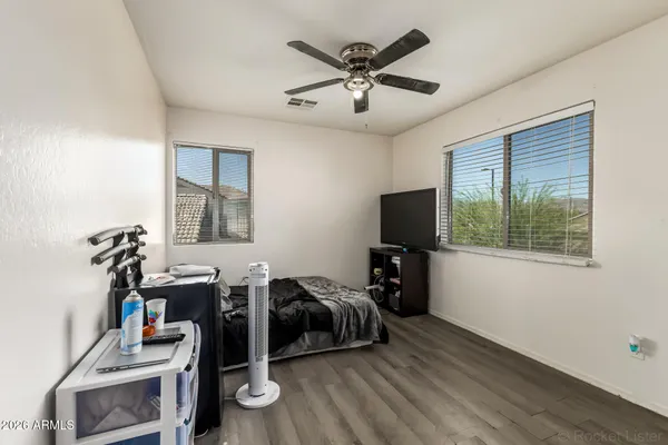 a view of a livingroom with furniture and a flat screen tv