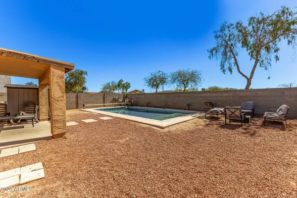 a view of a backyard of the house