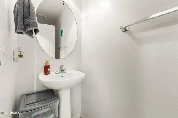 a bathroom with a sink and mirror