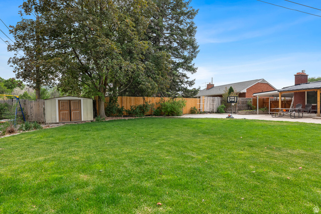 523 South Main Street Payson, UT 84651 - Photo 40 of 41 Spacious lawn area with mature trees and a privacy fence