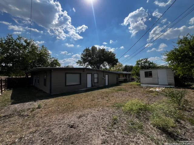a house view with a backyard space