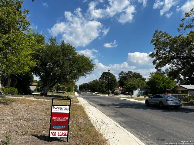 a view of street with parked cars