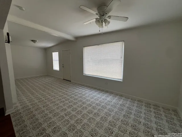 a view of an empty room and window