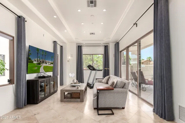 a spacious bathroom with a double vanity sink a large mirror and a bathtub