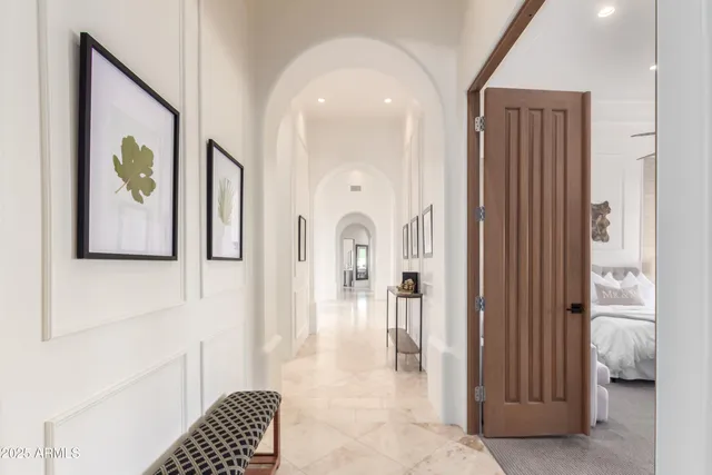 a front view of a house with garden and patio