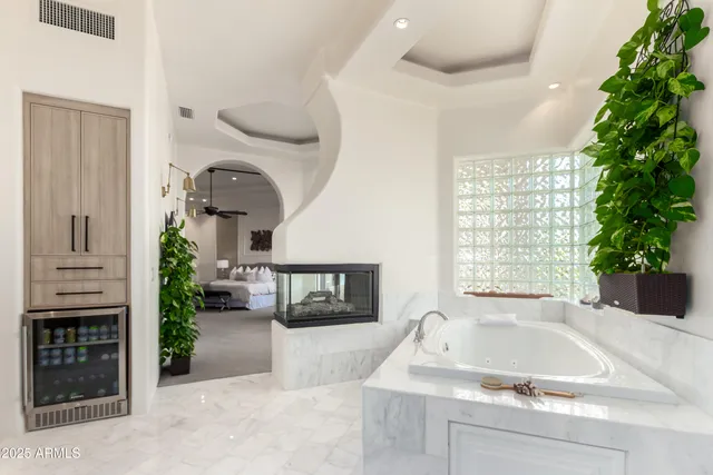 a view of swimming pool with a dining table and chairs