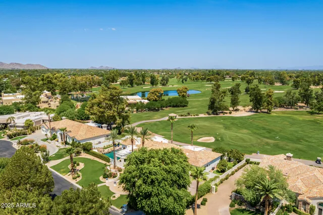 an aerial view of a house with a garden