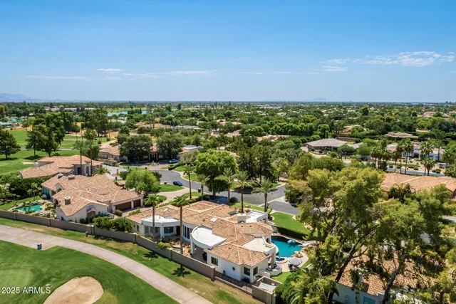 a view of a golf course with a lake