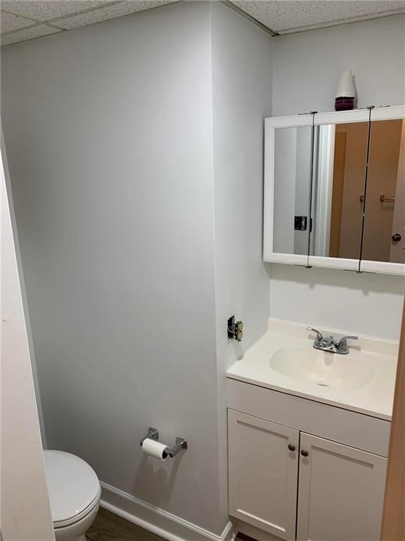 2607 Ligonier Street Latrobe, PA 15650 - Photo 4 of 6 a bathroom with a sink a toilet and mirror