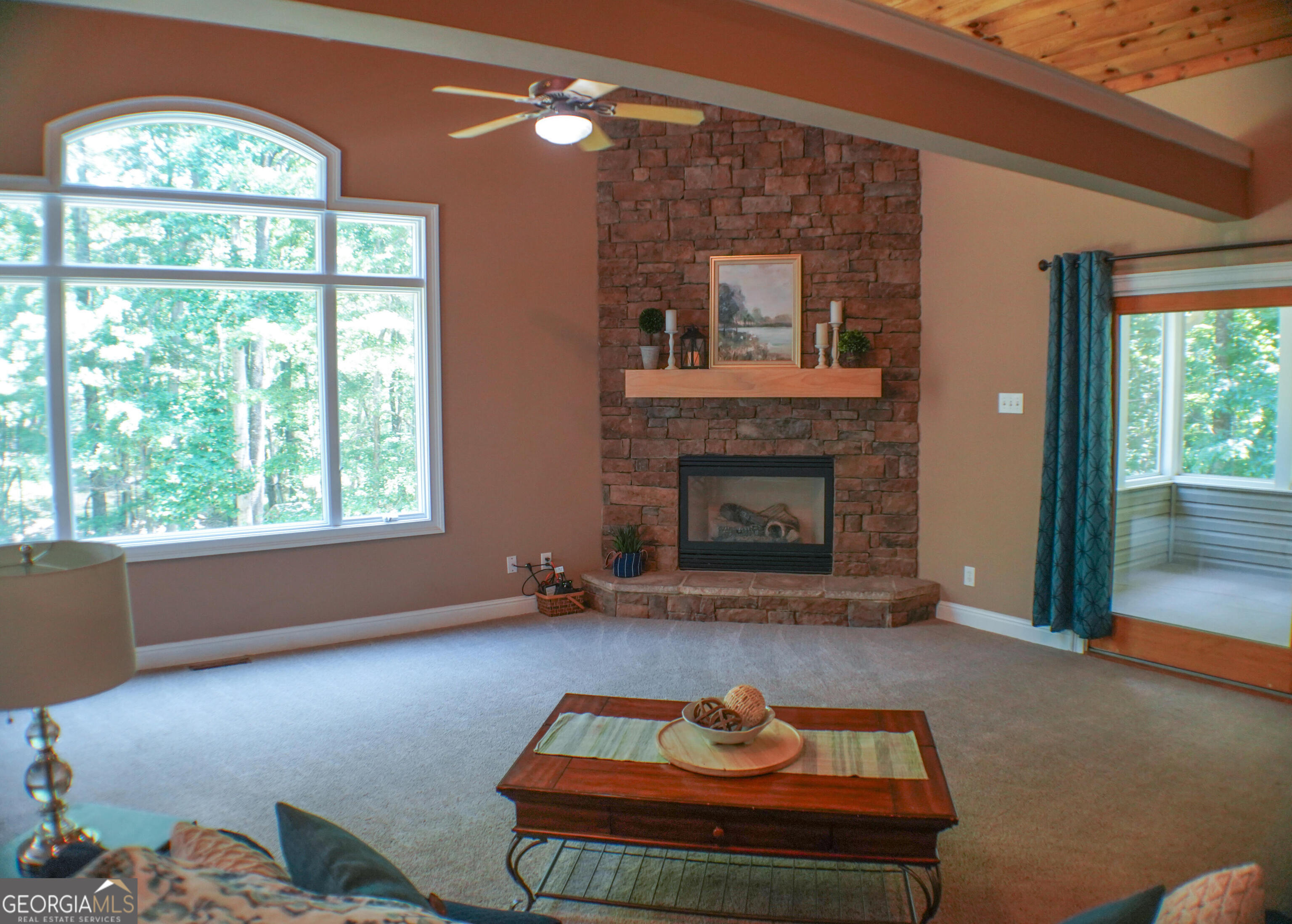 335 Winding Stream Trail Hampton, GA 30228 - Photo 5 of 35 a living room with furniture and a fireplace