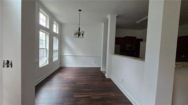 a view of an entryway with wooden floor