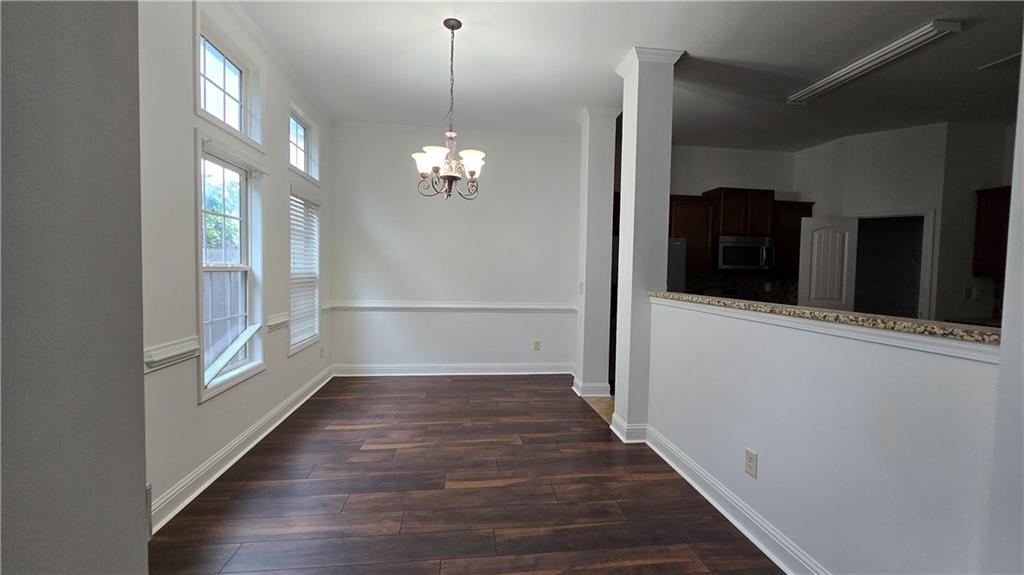 2275 Copper Trail Lane Northeast Buford, GA 30519 - Photo 14 of 39 a view of a hallway with wooden floor and staircase