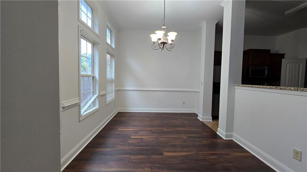 2275 Copper Trail Lane Northeast Buford, GA 30519 - Photo 15 of 39 a view of a hallway with wooden floor and staircase