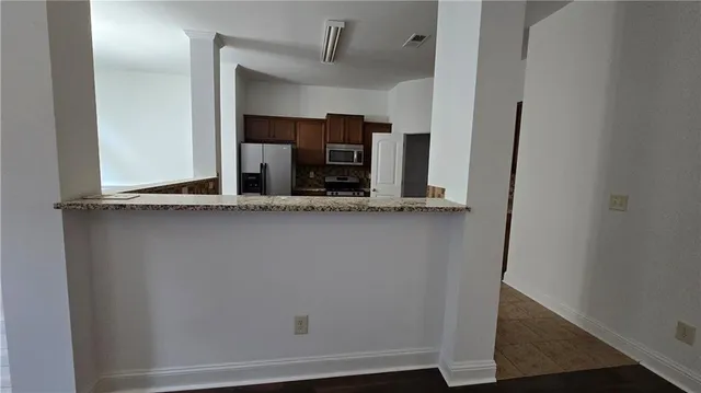 a view of cabinets and wooden floor
