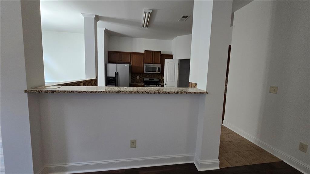2275 Copper Trail Lane Northeast Buford, GA 30519 - Photo 18 of 39 a view of cabinets and wooden floor