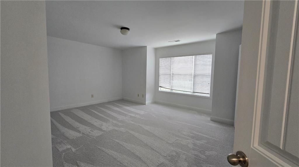 2275 Copper Trail Lane Northeast Buford, GA 30519 - Photo 25 of 39 a view of an empty room with a window