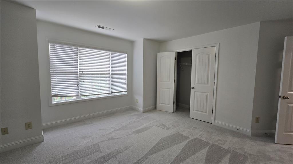 2275 Copper Trail Lane Northeast Buford, GA 30519 - Photo 28 of 39 a view of an empty room with a window