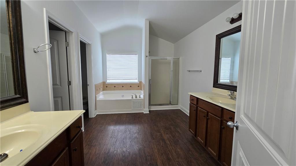 2275 Copper Trail Lane Northeast Buford, GA 30519 - Photo 37 of 39 a bathroom with a sink a mirror and a shower