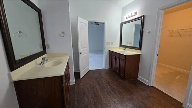 a bathroom with a sink a mirror and a toilet