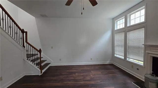 a view of an entryway with wooden floor