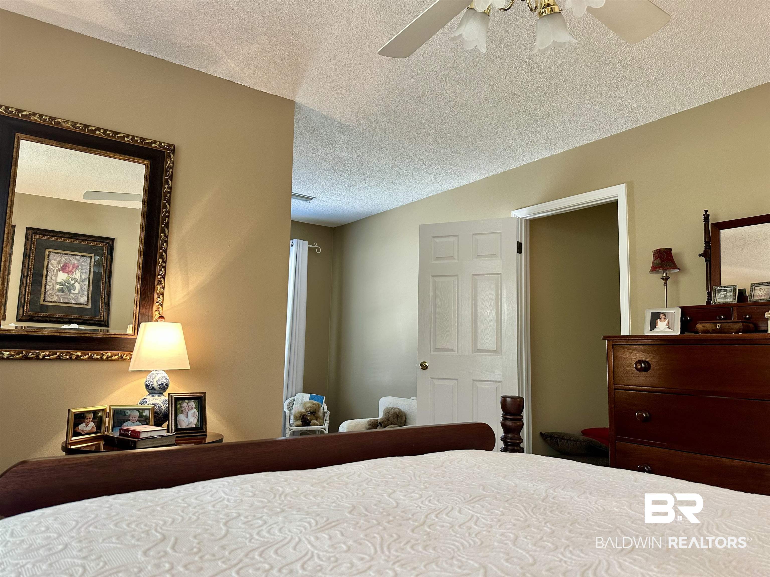 148 Brooks Boulevard Brewton, AL 36426 - Photo 31 of 45 Bedroom with lofted ceiling, a textured ceiling, and ceiling fan