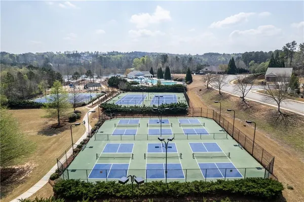 a view of a swimming pool with a yard