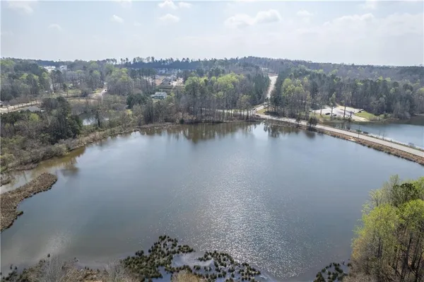 swimming pool view with a lake view