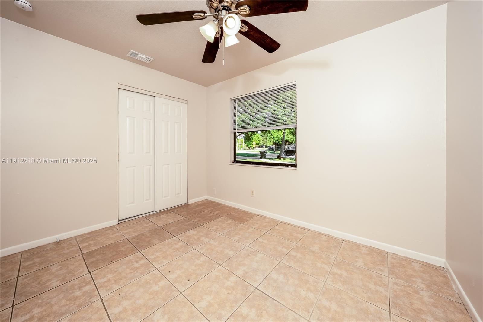 586 Udell Lane Delray Beach, FL 33445 - Photo 12 of 16 a view of an empty room with a window
