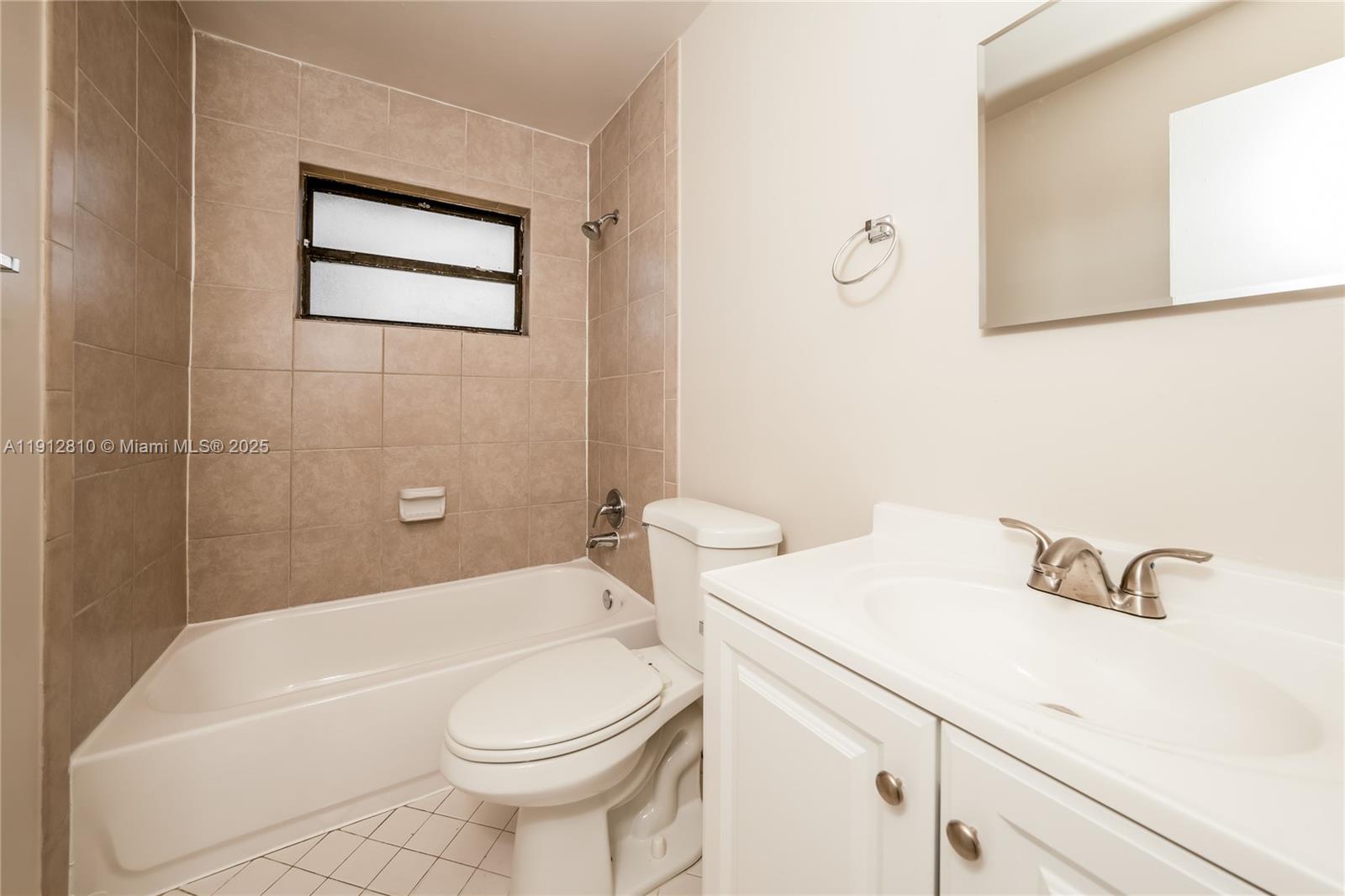 586 Udell Lane Delray Beach, FL 33445 - Photo 13 of 16 a bathroom with a sink a toilet and shower