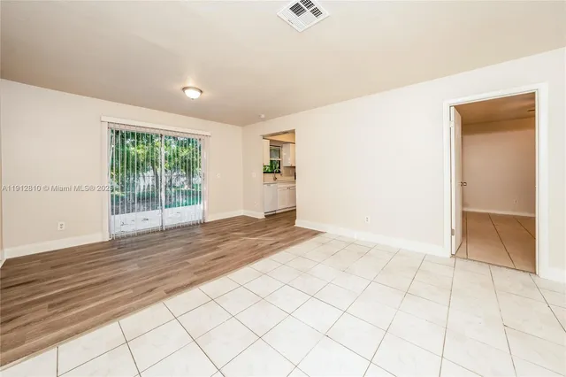 a view of an empty room and window