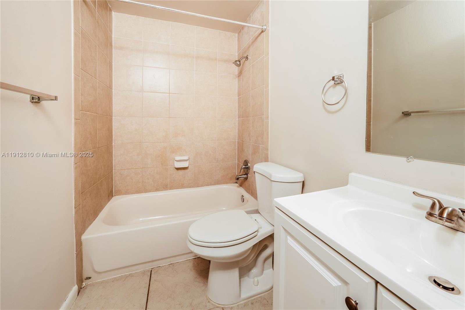 586 Udell Lane Delray Beach, FL 33445 - Photo 9 of 16 a bathroom with a sink a toilet and shower