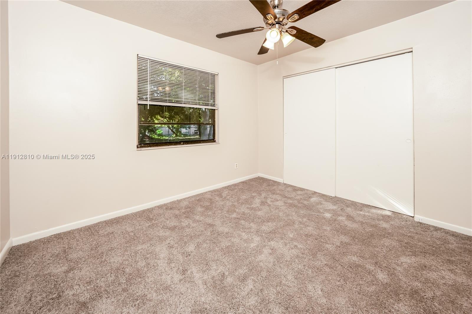 586 Udell Lane Delray Beach, FL 33445 - Photo 10 of 16 a view of an empty room with a window