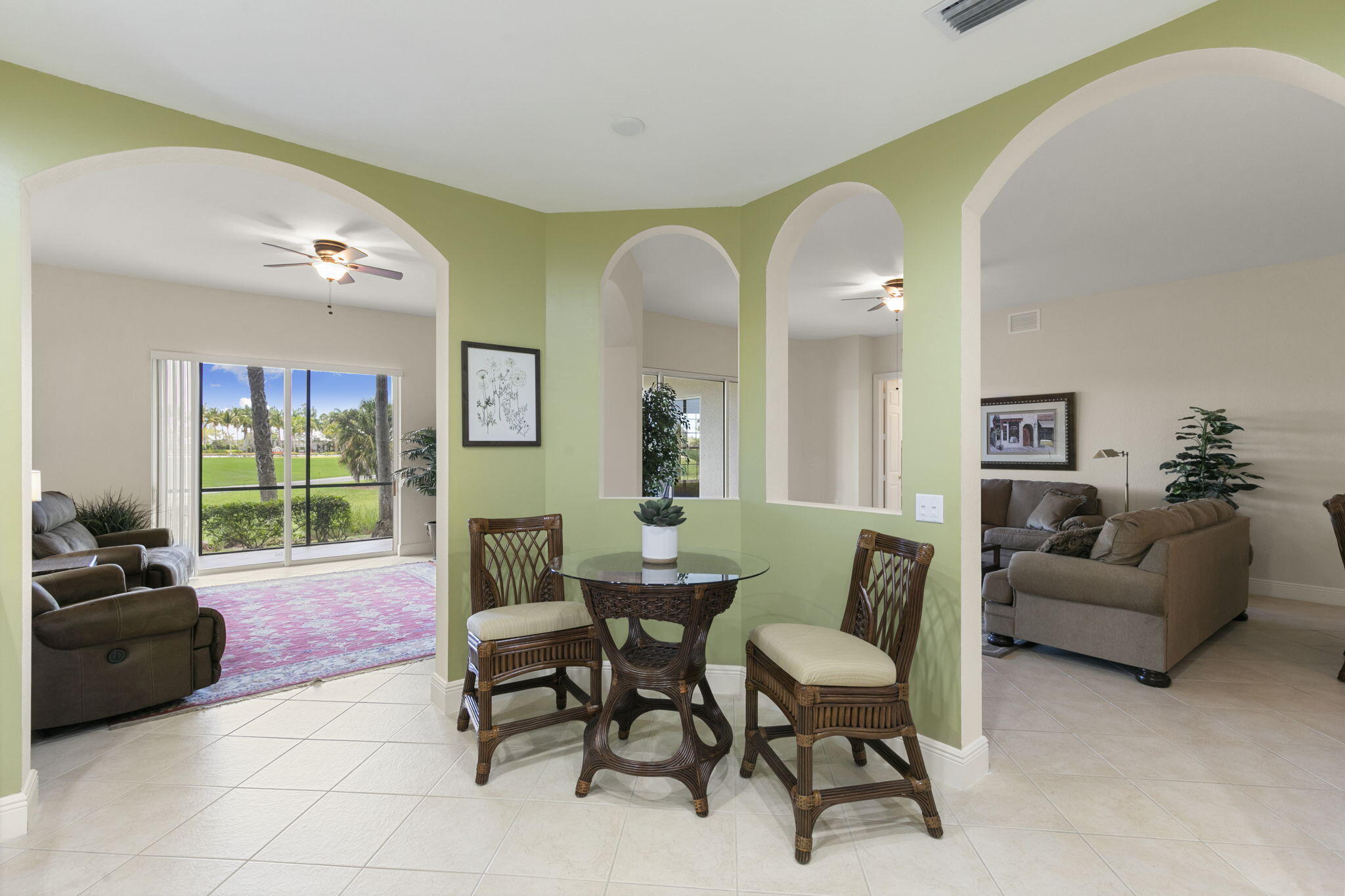 9066 Cascada Way, Unit 101 Naples, FL 34114 - Photo 16 of 51 a living room with furniture and a large window