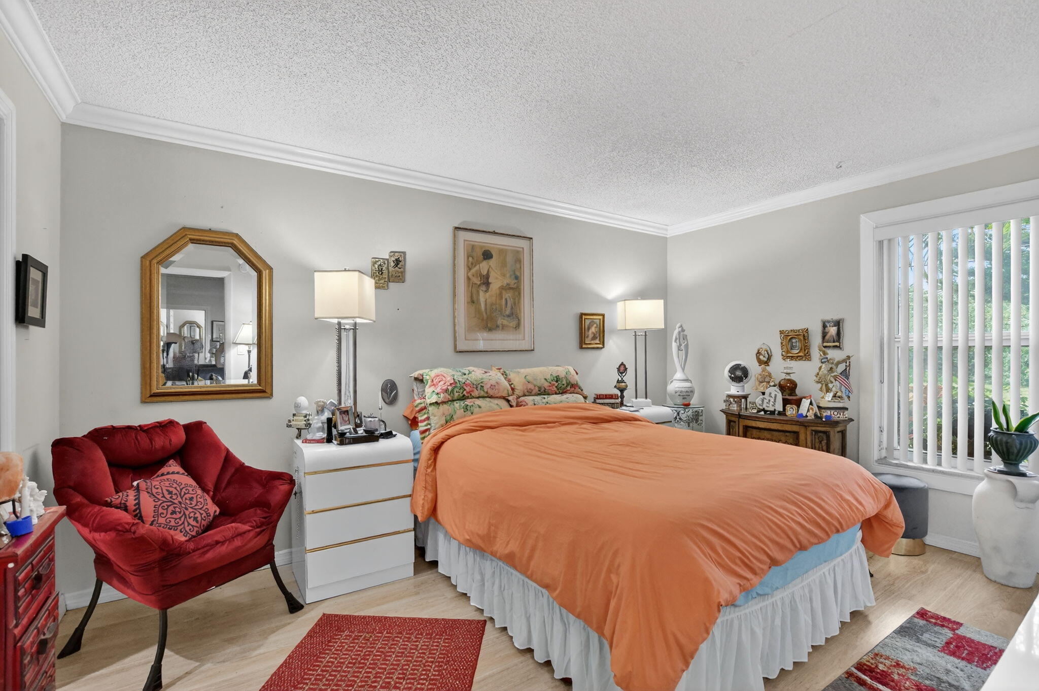 450 Northwest 20th Street, Unit 1140 Boca Raton, FL 33431 - Photo 11 of 29 a spacious bedroom with a bed and a couch