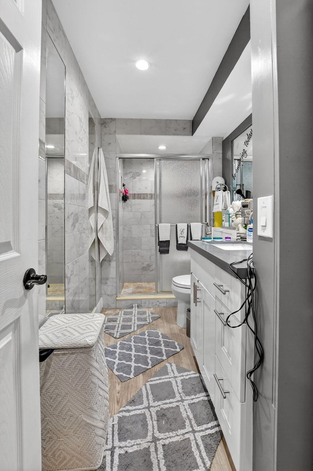 450 Northwest 20th Street, Unit 1140 Boca Raton, FL 33431 - Photo 15 of 29 a bathroom with a double vanity sink mirror and shower