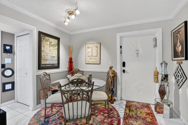 a living room with furniture two window and wooden floor