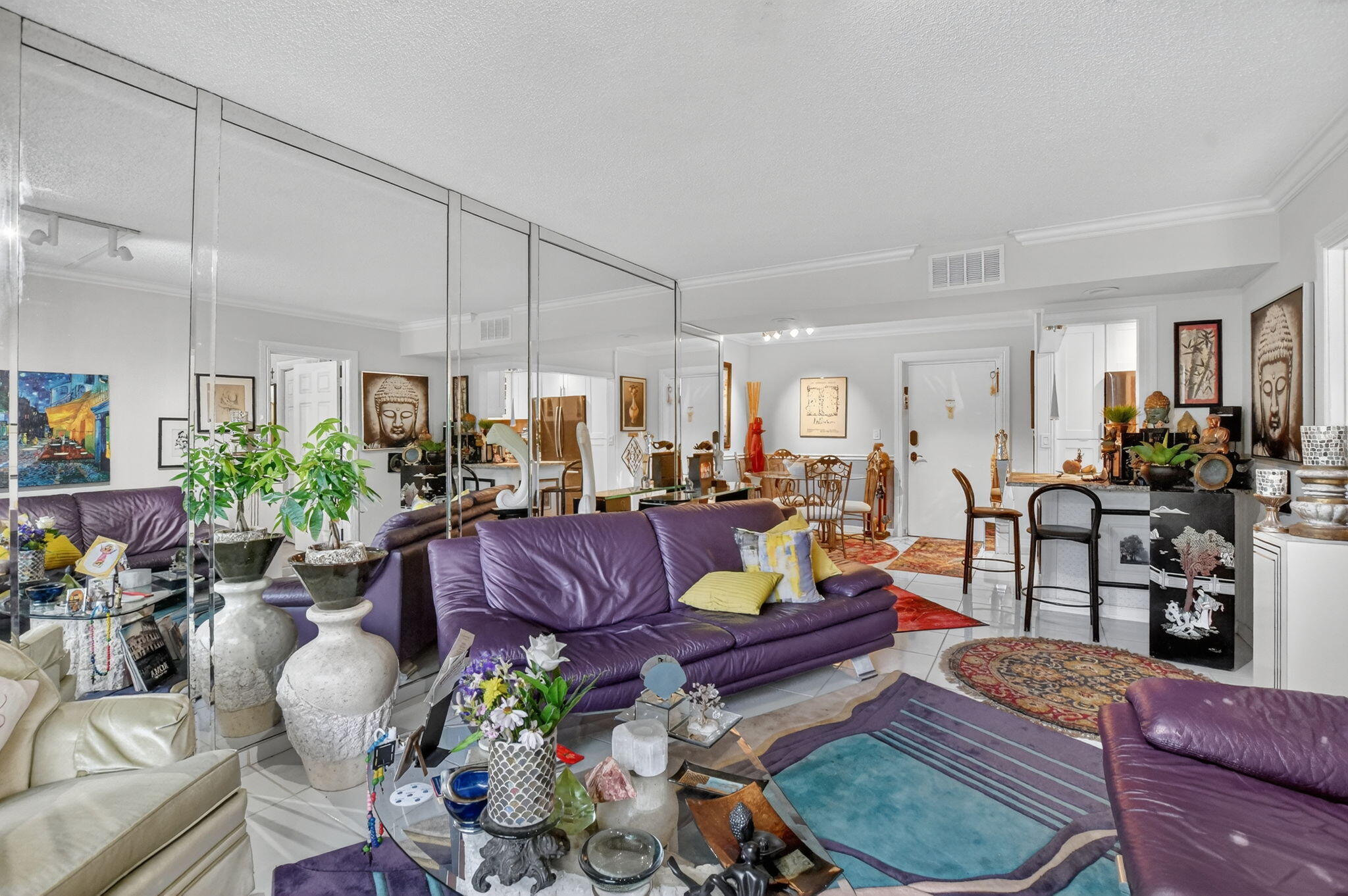 450 Northwest 20th Street, Unit 1140 Boca Raton, FL 33431 - Photo 9 of 29 a living room with furniture potted plant and kitchen view