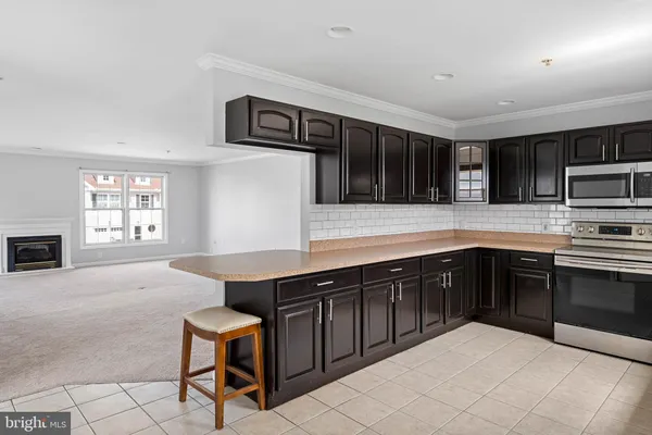 a kitchen with stainless steel appliances granite countertop a sink and cabinets