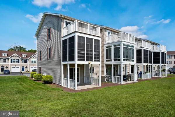 a big house with a big yard and large trees