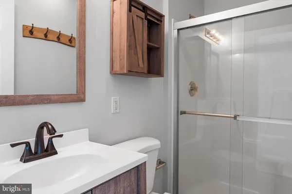 a bathroom with a sink and mirror