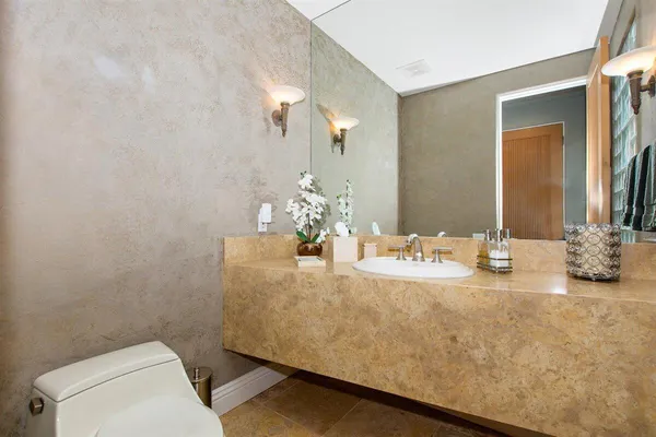 a bedroom with a bed couch and window